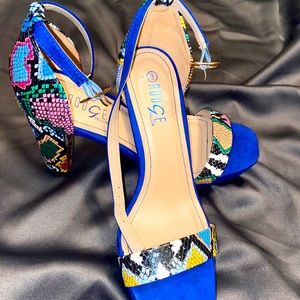 Blue shoe with multi color snakeskin straps
